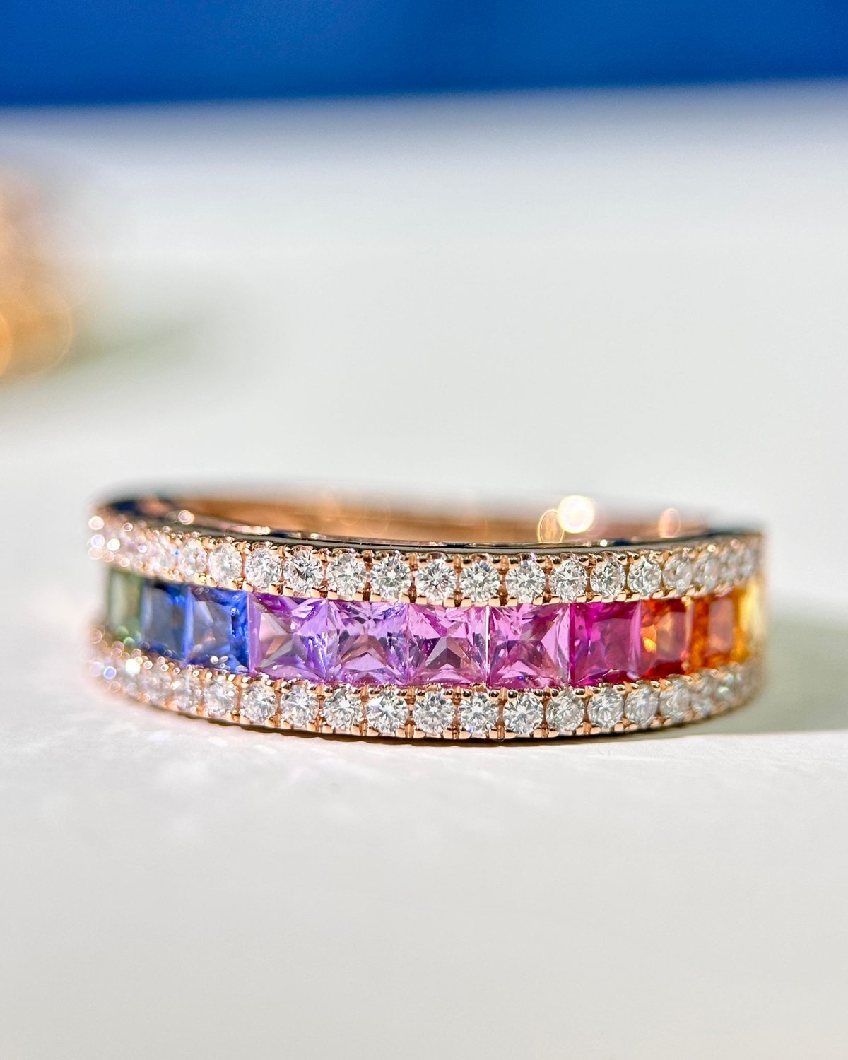 Rose gold rainbow sapphire eternity ring